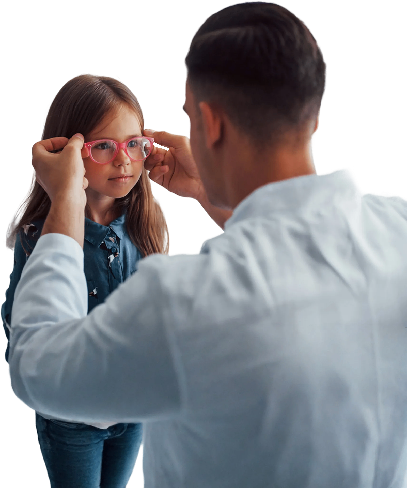 Optician fitting glasses on a child